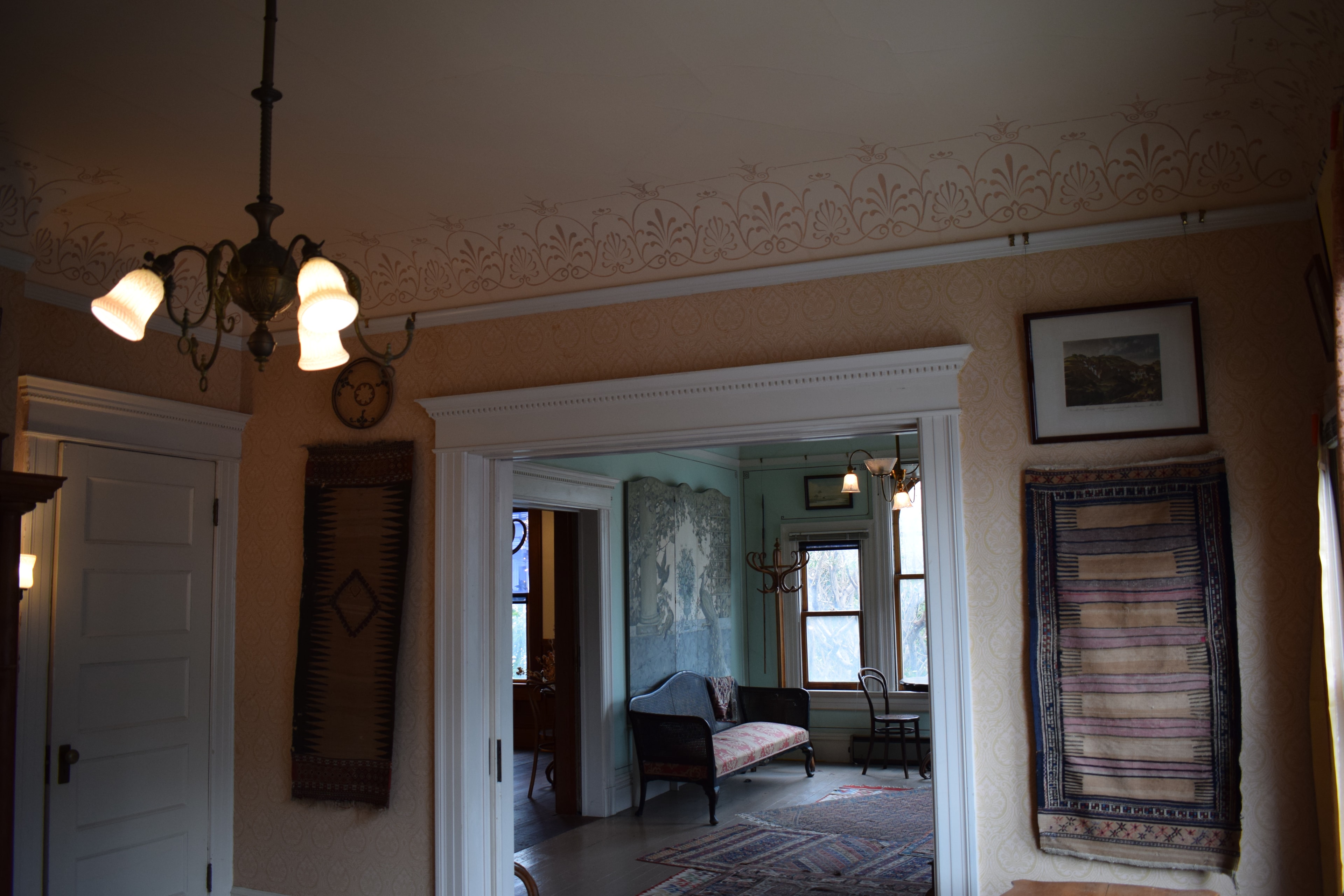 Wide view of the anthemion sitting room showing cornice frieze and period furnishings