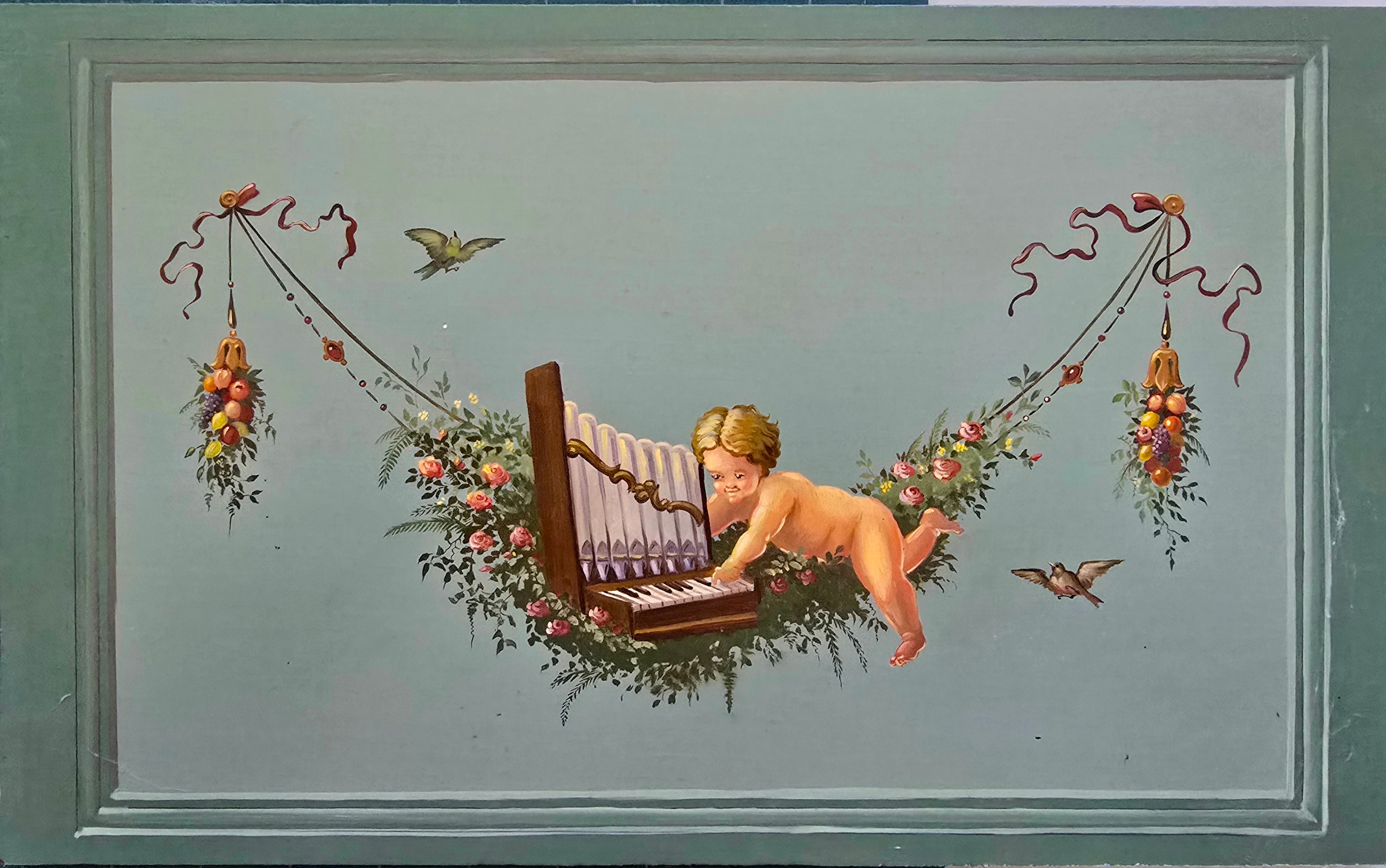Detail panel: putto playing a pipe organ amid rose garlands, fruit swags, and birds — Owen Daly Italian harpsichord