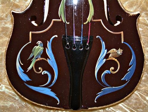 Detail of the lower bout showing parrots and tailpiece decoration