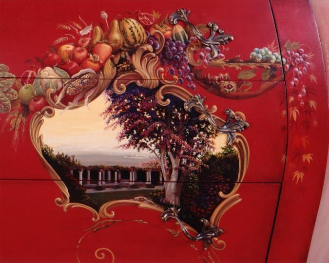 Detail of a rococo cartouche on the bombé chest showing a view of the owner's garden