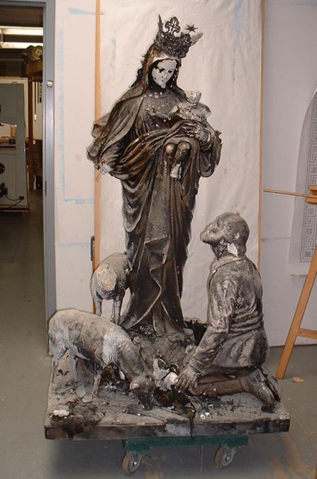 Madonna della Guardia statue — fire damage before restoration