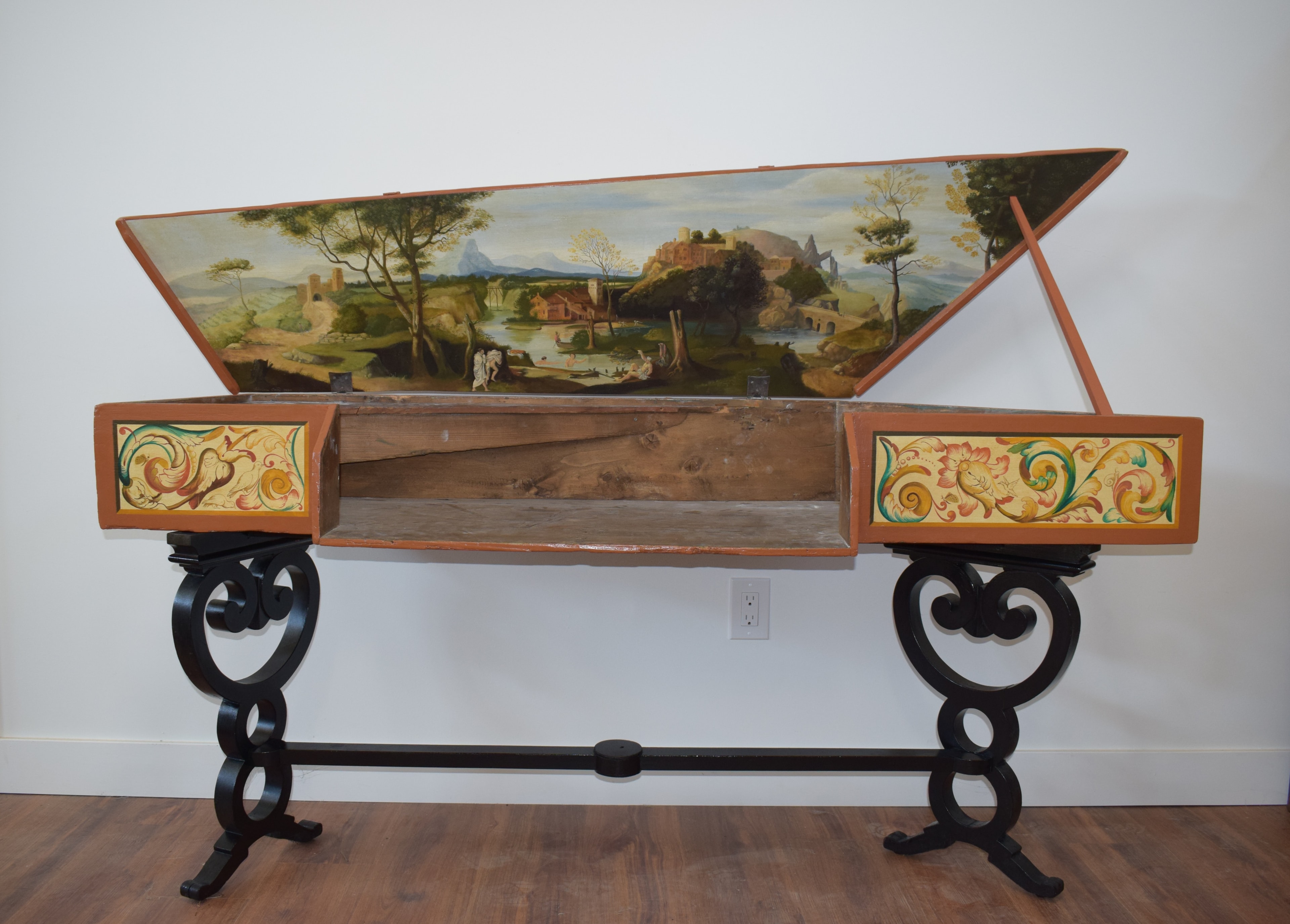 Open virginals showing painted interior landscape on the lid in the Flemish tradition